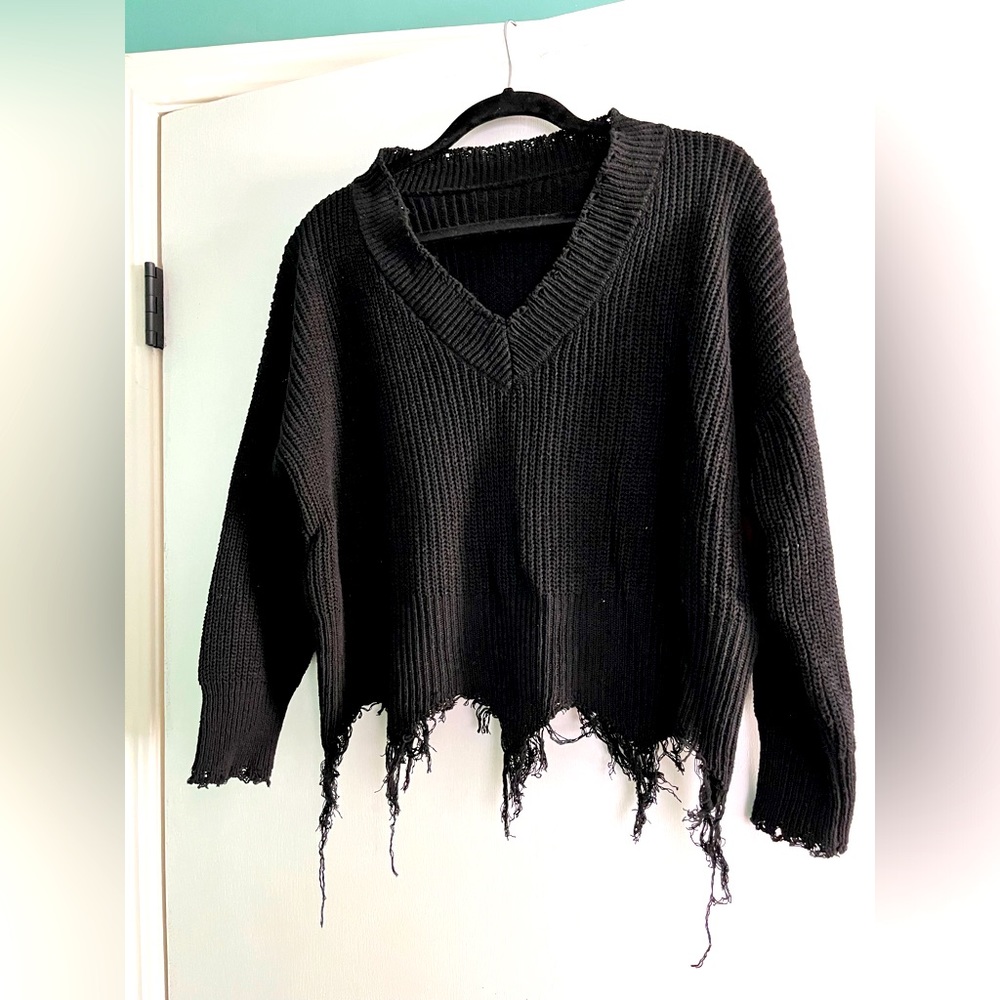 Black v neck ripped sweater